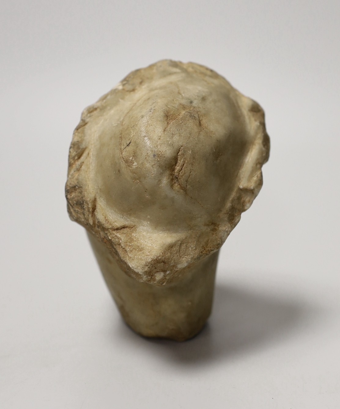 A marble head of a man in Hellenistic style, 12cm long